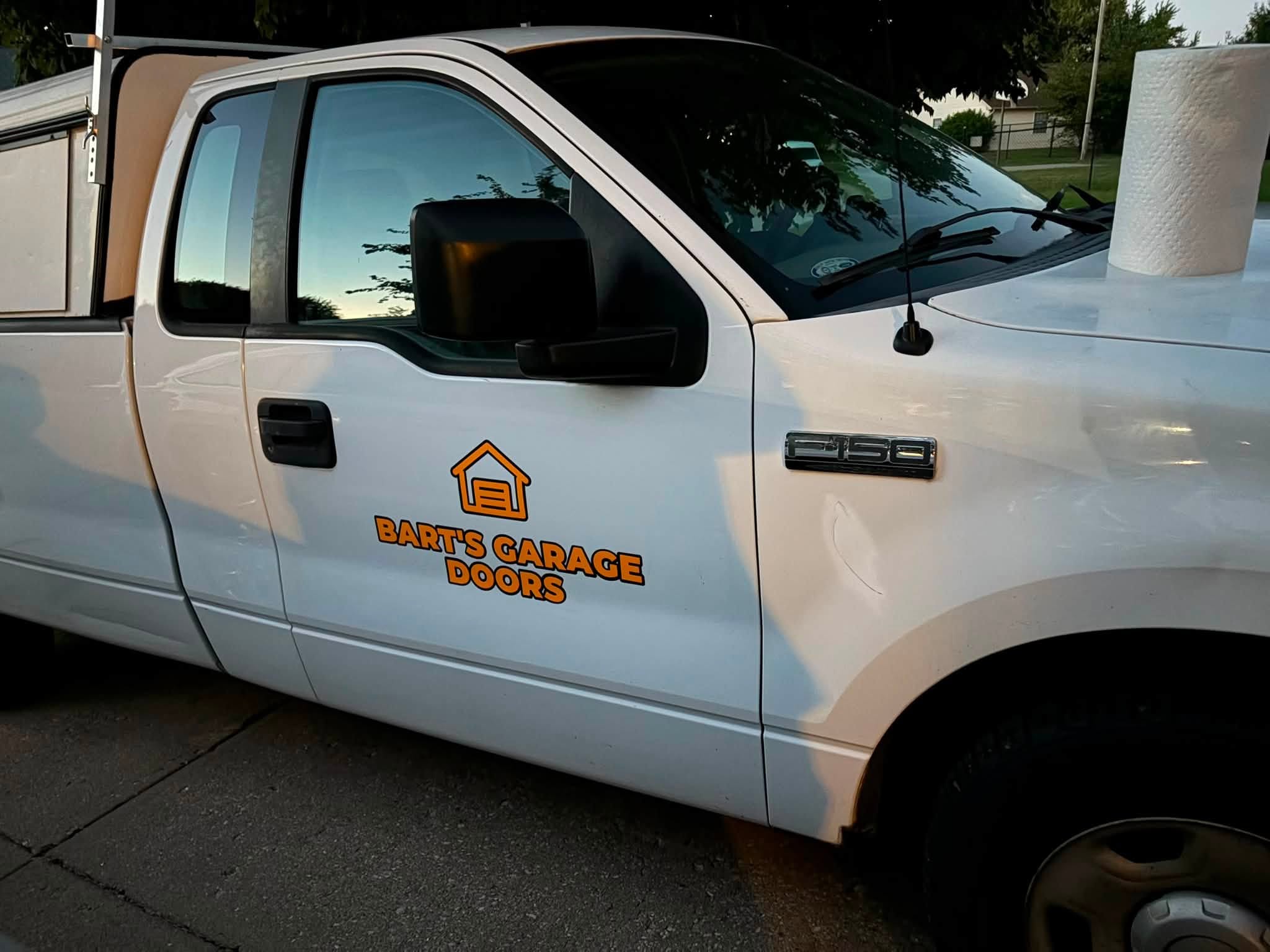 Close-up of the (317) 340-0191 phone number decal on the truck bed