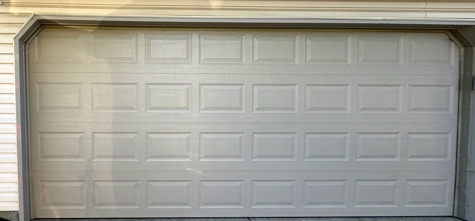 doorLink Model 3610 insulated raised panel garage door in Sandstone