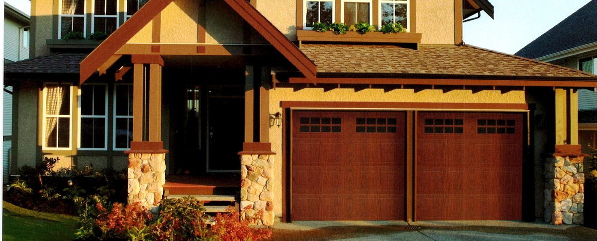 doorLink 430/431 grooved carriage house garage doors in Walnut with Stockton windows